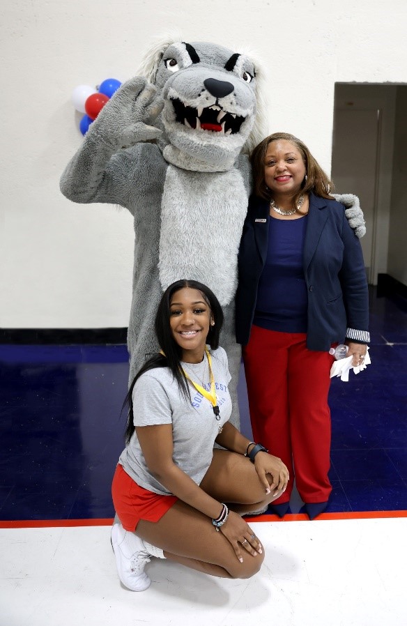 Dr. Tracy Hall pictured with a student and Southwest’s Saluqi mascot at the  First-Time Freshmen Convocation.