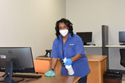 Joyce Stallion disinfects a classroom in preparation for the reopening of Southwest’s Macon Cove and Union Ave. campuses July 8, 2020.