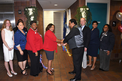 Southwest Tennessee Community College President Tracy D. Hall and Southwest alumnus and former president of the Southwest Student Veterans Organization Adonis Daniels cut the ribbon on the new Veterans Support Center on the Macon Cove campus, along with other Southwest officials and supporters.