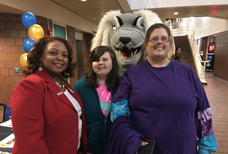 President Tracy D. Hall discusses academics and student life with Raleigh-Egypt High School senior Breeianna Mayo and her mother, Brandy Morris.