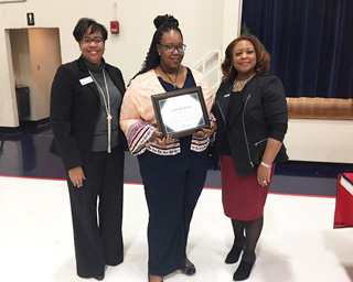 Chelbie Reed (middle) accepts her certificate of completion at the 2018 Student Leadership Institute Reception from Dr. Jacqueline Taylor and President Tracy D. Hall.