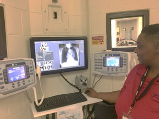 Tracy Freeman Jones displays digital images on the computer screen via the new computer controllers.