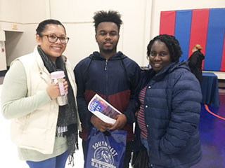 SCS Bilingual Communications and Outreach Coordinator Talia Palacio, White Station High School senior Cameron Allen and his mother, Cathy, at SCS Senior Night inside the Nabors Gymnasium. 
