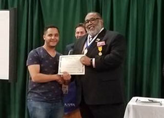 Hammam Alomari receives his honorable mention certificate in Short Fiction.