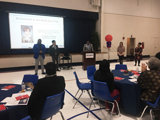 Associate Director of K-12 and Community Partnership Shawn Boyd (at the podium) and the admissions team provide an overview of their department
