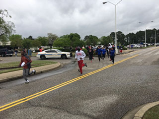 Runners start the race at the Clock Tower on the Macon Cove campus.  