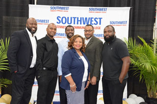 President Tracy D. Hall poses with members of the Underground band. The group added an elegant touch to the event by playing classic hits and theme music throughout the ceremony.