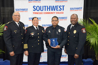 Southwest Police Chief Angela Webb and fellow Southwest Police leadership present Officer Carlos Watts (center, right), the Director of Police Services/Public Safety Award.