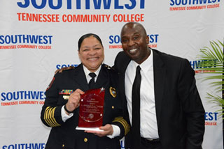 Vice President for Finance and Administration Mike Neal presents Police Chief Angela Webb the Finance and Administrative Services Excellence Award.