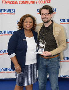President Tracy D. Hall presents Academic Support Center Assistant Director Thomas Cole the 2019 President’s Award.