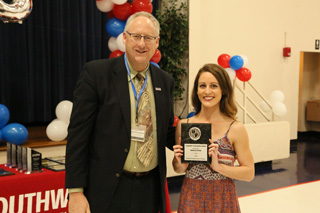 Allied Health and Natural Sciences Dean Evan McHugh presents the Physical Therapy Assistant Academic Excellence Award to Mallory Ceolla.