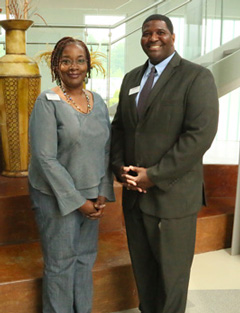 Dean Robin Cole congratulates Karen Taylor on her Employee of the Month award.