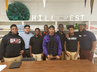 Men’s Huddle mentors David Aquilar-Vazquez (second from left), Ron Claxton (fourth from left) and Samuel Hennings (at right) meet with Hillcrest High School students for a session on leadership.