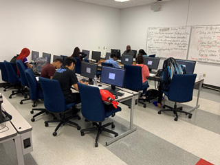 Students in the Tennessee Achieves summer institute at the Whitehaven Center work on an English assignment taught by instructor Brice Wilson.