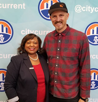 Southwest Student Ambassador Amir Coleman visits with Mick Ebeling.