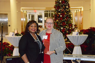 Foundation board president Ann Langston accepts the Southwest Tennessee Community College’s Board Member Emeritus Award on behalf of recipient Fred Davis.