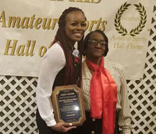 Ashley Shields receives her Memphis Amateur Sports Hall of Fame plaque at the Hilton Memphis in 2018.