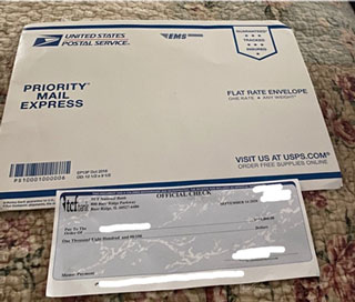Package and check received by Southwest student after responding to suspicious work-at-home email offer.