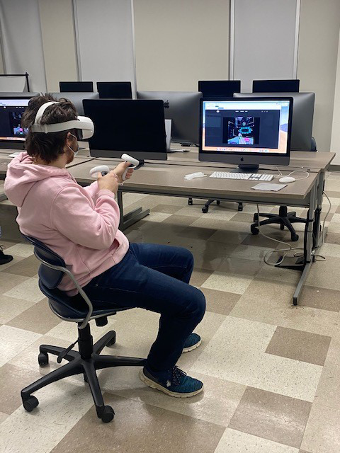 Dylan Hartmann navigates his virtual reality tour on an Apple computer using an Oculus Quest 2 headset.