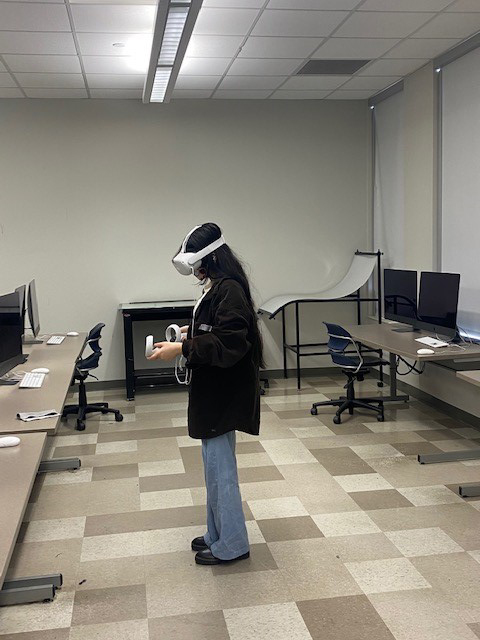 Amena Chaudhry attends a virtual reality lab wearing an Oculus Quest 2 headset. 