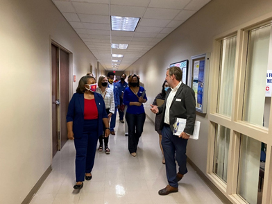 Physical Plant Director Jonathan Welden gives President Tracy D. Hall and governance and student leaders a tour of the safety installations at the Union Avenue campus.