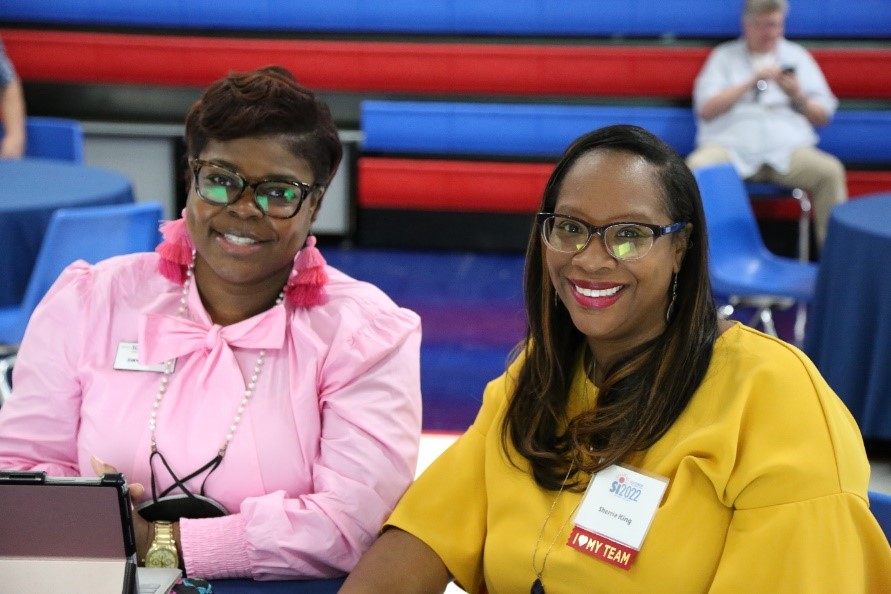 Associate Professor of Criminal Justice Studies Joanitha Barnes and Dean of Division of Humanities, Social Sciences and Mathematics Dr. Sherria King enjoy the opening ceremony of Summer Institute 2022. 