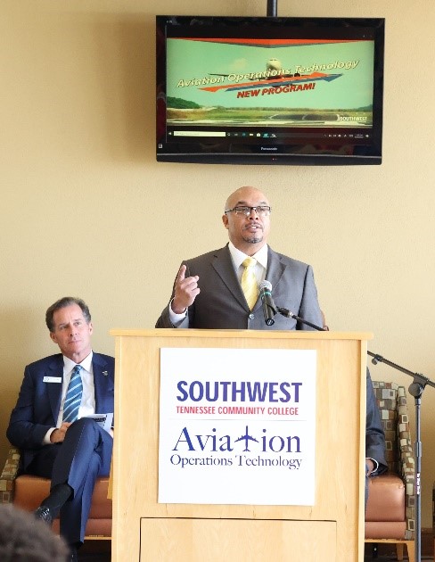 Albert Coleman speaks to attendees at the Aviation Open House.  