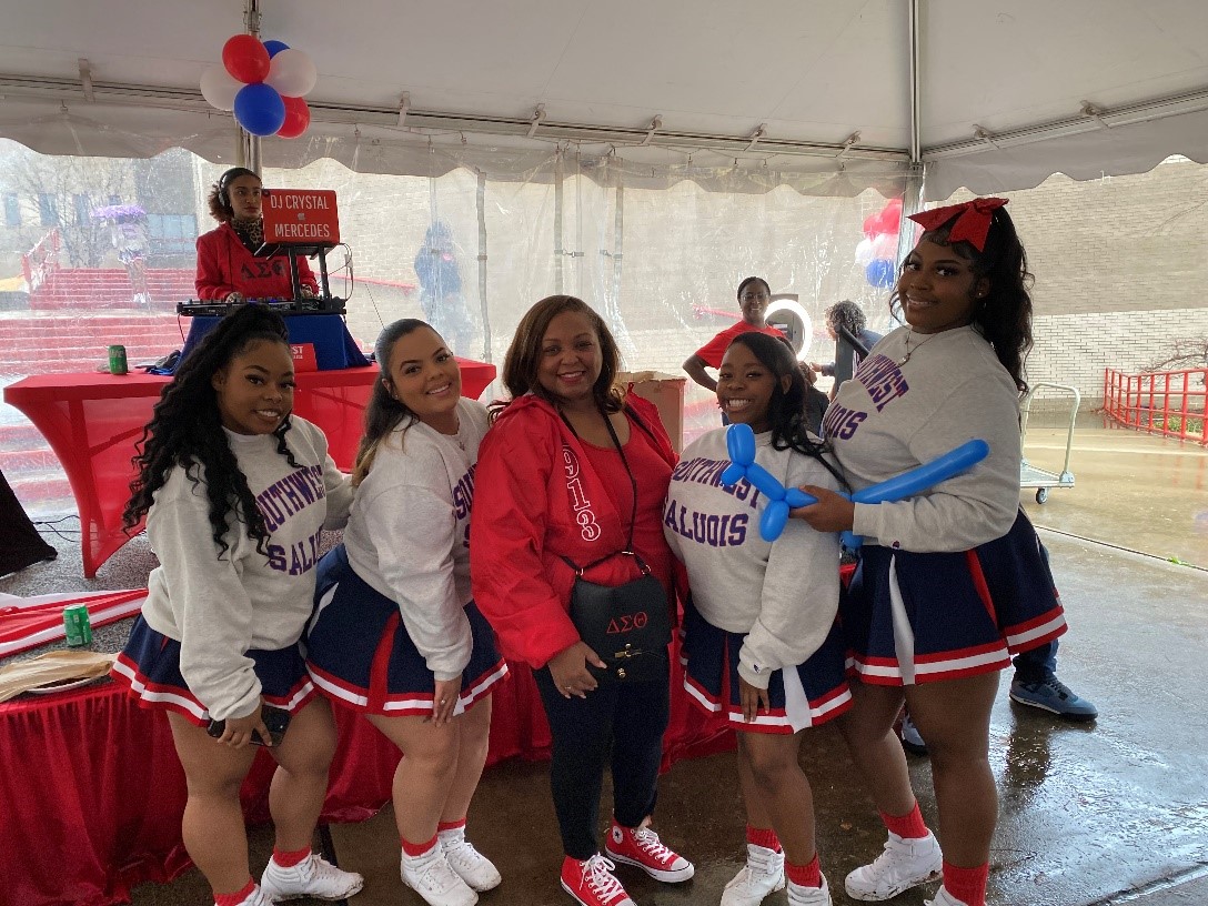 Dr. Tracy Hall (m) with members of the Saluqi cheer team