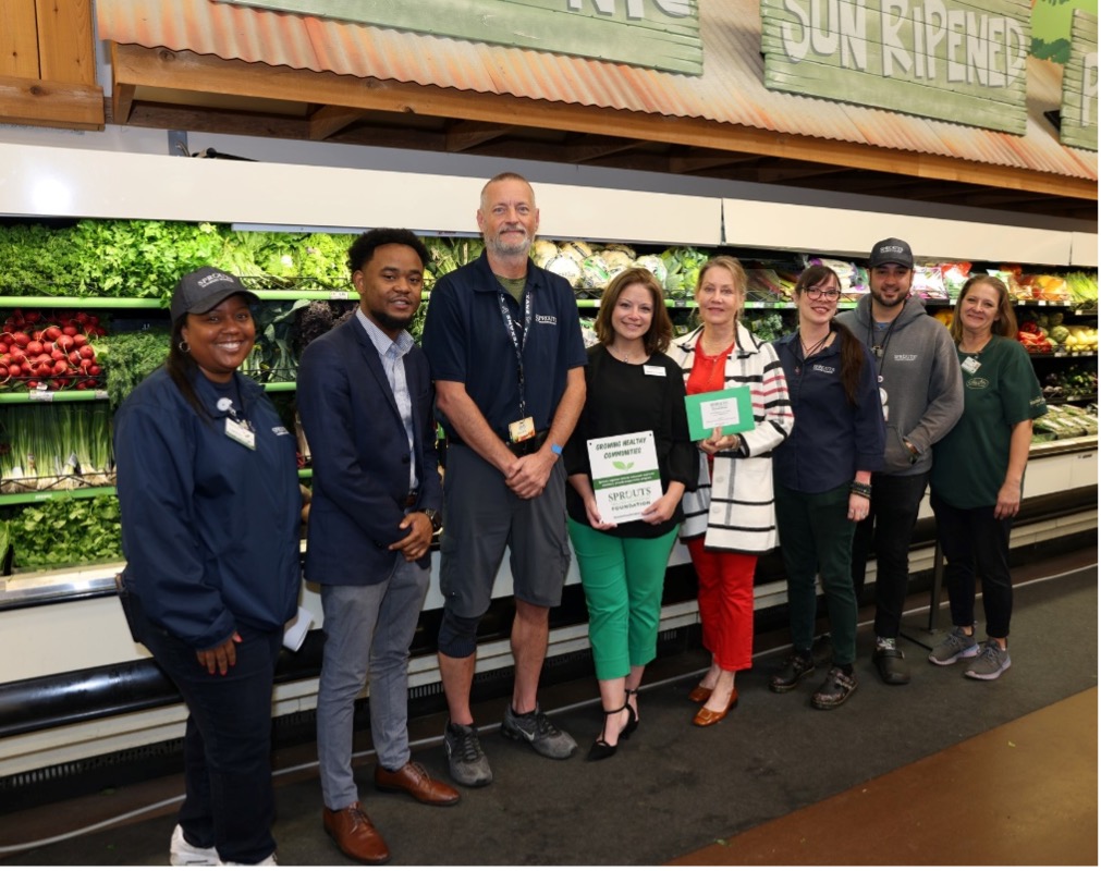 Sprouts Farmers Market employees and Southwest Community Community College staff members take a photo at a grant donation ceremony on Sept.7, 2024.