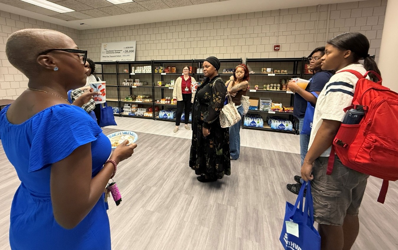 Southwest student Nacaria Royal (pictured in the middle) joins fellow students for a tour of The Pantry.